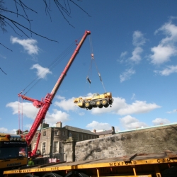 350 ton crane lifting 50 ton crane into courtyard Dublin