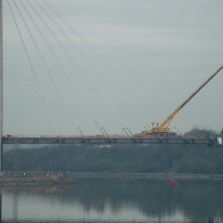 200 ton liebherr working on a new cable suspended bridge 
